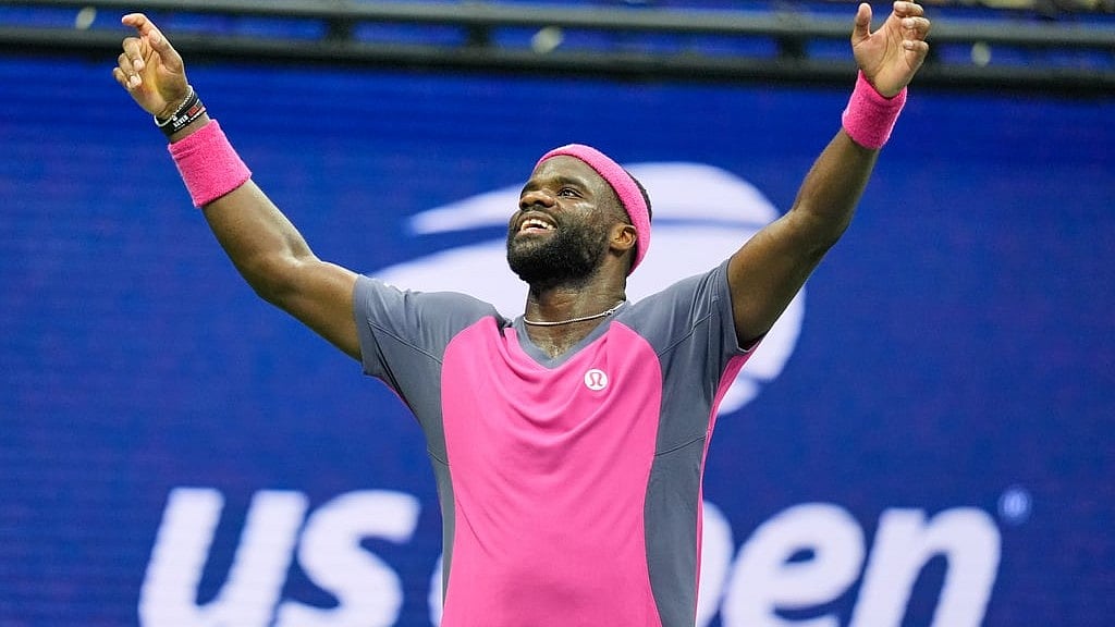 Frances Tiafoe, of the United States, celebrates winning a match against Alex Michelsen, of the United States, during the quarterfinal round of the U.S. Open tennis championships. - Seth Wenig/ AP Photo