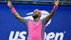 Frances Tiafoe, of the United States, celebrates winning a match against Alex Michelsen, of the United States, during the quarterfinal round of the U.S. Open tennis championships. - Seth Wenig/ AP Photo