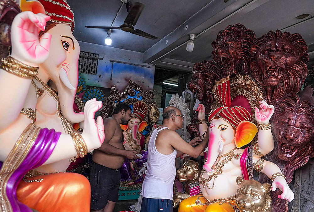 Artists give final touches to idols of lord Ganesh ahead of the Ganesh Chaturthi festival, at Kumartuli, in Kolkata, West Bengal, Sunday, Sept. 6, 2026. 