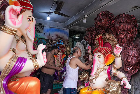 Artists give final touches to idols of lord Ganesh ahead of the 'Ganesh Chaturthi' festival, at Kumartuli, in Kolkata, West Bengal, Sunday, Sept. 6, 2026. 