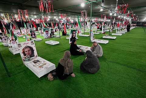 Women visit a section of Minab's cemetery that was set aside for those killed in a Feb. 28 U.S. airstrike on Shajareh Tayyebeh school, in Minab, southern Iran, Monday, Sept. 7, 2026. 
