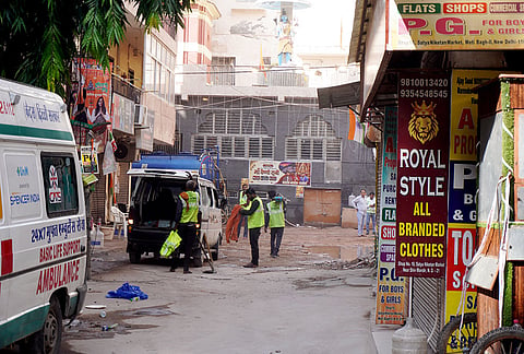 Municipal Corporation of Delhi (MCD) personnel arrive to dismantle an unsafe adjacent structure following the deadly multi-storey building collapse tragedy at Satya Niketan, in New Delhi.