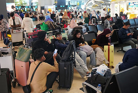 People wait as flights are disrupted due to the eruption of Mount Anak Krakatau, at Soekarno-Hatta International Airport in Tangerang, Indonesia, Monday, Sept. 7, 2026. 
