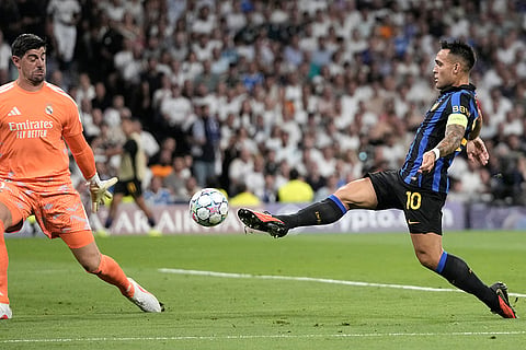 Inter Milan's Lautaro Martinez tries to score a goal during a Champions League soccer match between Real Madrid and Inter Milan in Madrid, Spain.