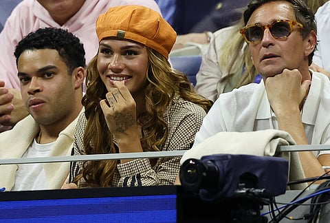 American soccer player Trinity Rodman, center, watches her boyfriend Ben Shelton, of the United States, play Carlos Alcaraz, of Spain, in the quarterfinal round of the U.S. Open tennis championships, Tuesday, Sept. 8, 2026, in New York.