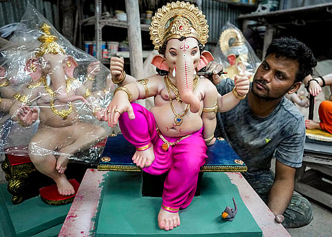 An artist works on an idol of Lord Ganesh ahead of the 'Ganesh Chaturthi' festival, in Mumbai, Maharashtra, Wednesday, Sept. 9, 2026. 