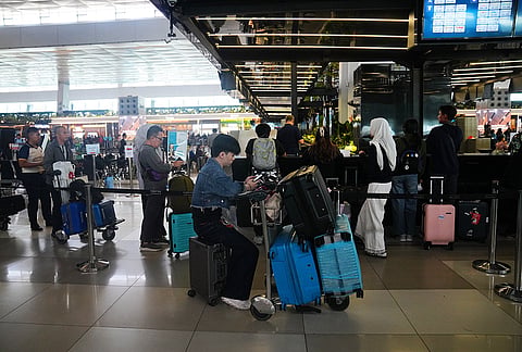 Travelers wait for their flights at Soekarno-Hatta International Airport in Tangerang, Indonesia, Sunday, Sept. 6, 2026. 