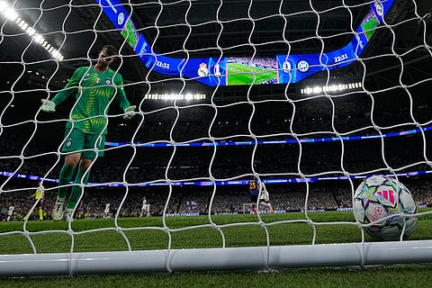 Inter Milan's goalkeeper Josep Martinez reacts after the goal by Real Madrid's Kylian Mbappe, during a Champions League soccer match between Real Madrid and Inter Milan in Madrid, Spain.