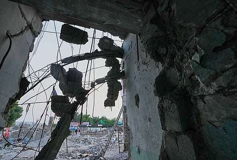 Chunks of concrete hang from exposed reinforcing bars at the Shajareh Tayyebeh school, damaged in a Feb. 28 U.S. airstrike in Minab, southern Iran, Monday, Sept. 7, 2026. 