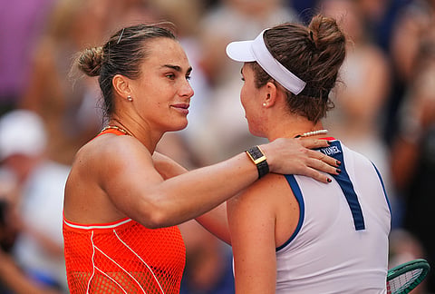 Aryna Sabalenka, of Belarus, left, and Linda Noskova, of the Czech Republic, meet at the net after Sabalenka won a match during the quarterfinal round of the U.S. Open tennis championships, Tuesday, Sept. 8, 2026, in New York. 
