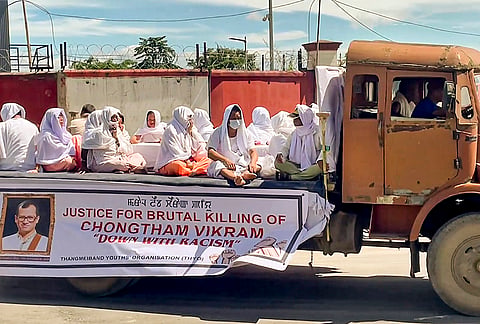 Family members and relatives receive mortal remains of 54-year-old musician Chongtham Vikram Singh, at Bir Tikendrajit International Airport, in Imphal, Manipur. Singh succumbed to injuries after he was allegedly assaulted outside his apartment at Kilokari village in Delhi in the early hours of Monday, Sept. 7, 2026. 