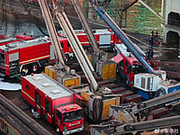 X : At least 20 people were killed when a foreign-flagged cargo ship caught fire at a Qingdao shipyard.