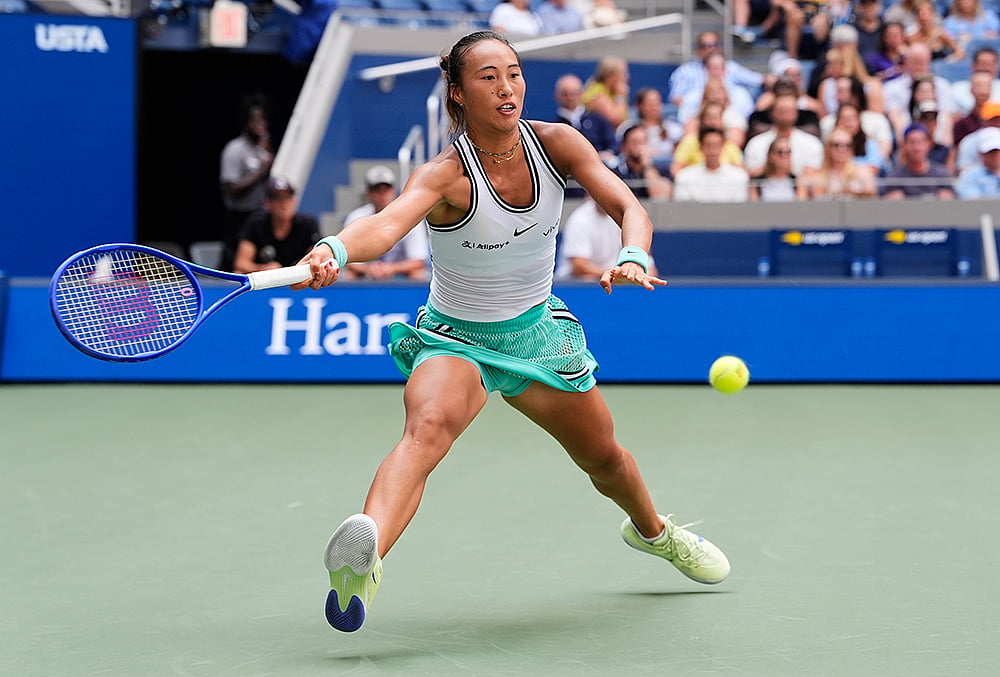 Qinwen Zheng, of China, returns the ball to Elena Rybakina, of Kazakhstan, during the quarterfinal round of the U.S. Open tennis championships, Wednesday, Sept. 9, 2026, in New York. 