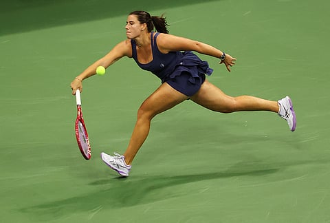 Emma Navarro, of the United States, stretches to hit a return to Jessica Pegula, of the United States, during the quarterfinal round of the U.S. Open tennis championships, Tuesday, Sept. 8, 2026, in New York. 