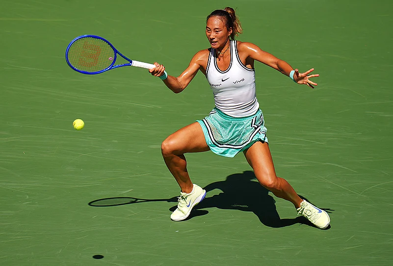 Qinwen Zheng, of China, returns the ball to Elena Rybakina, of Kazakhstan, during the quarterfinal round of the U.S. Open tennis championships, Wednesday, Sept. 9, 2026, in New York.