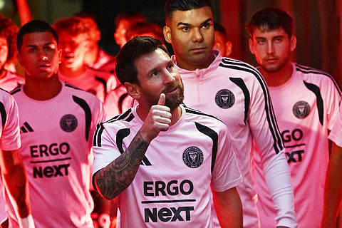 Inter Miami's Lionel Messi, center, arrives before an MSL soccer match against the Chicago Fire in Chicago.