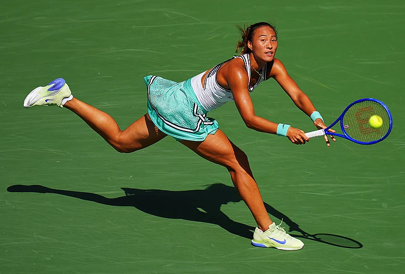 Qinwen Zheng, of China, returns the ball to Elena Rybakina, of Kazakhstan, during the quarterfinal round of the U.S. Open tennis championships, Wednesday, Sept. 9, 2026, in New York.