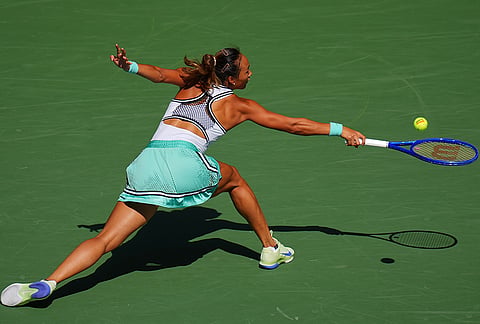 Qinwen Zheng, of China, returns the ball to Elena Rybakina, of Kazakhstan, during the quarterfinal round of the U.S. Open tennis championships, Wednesday, Sept. 9, 2026, in New York. 
