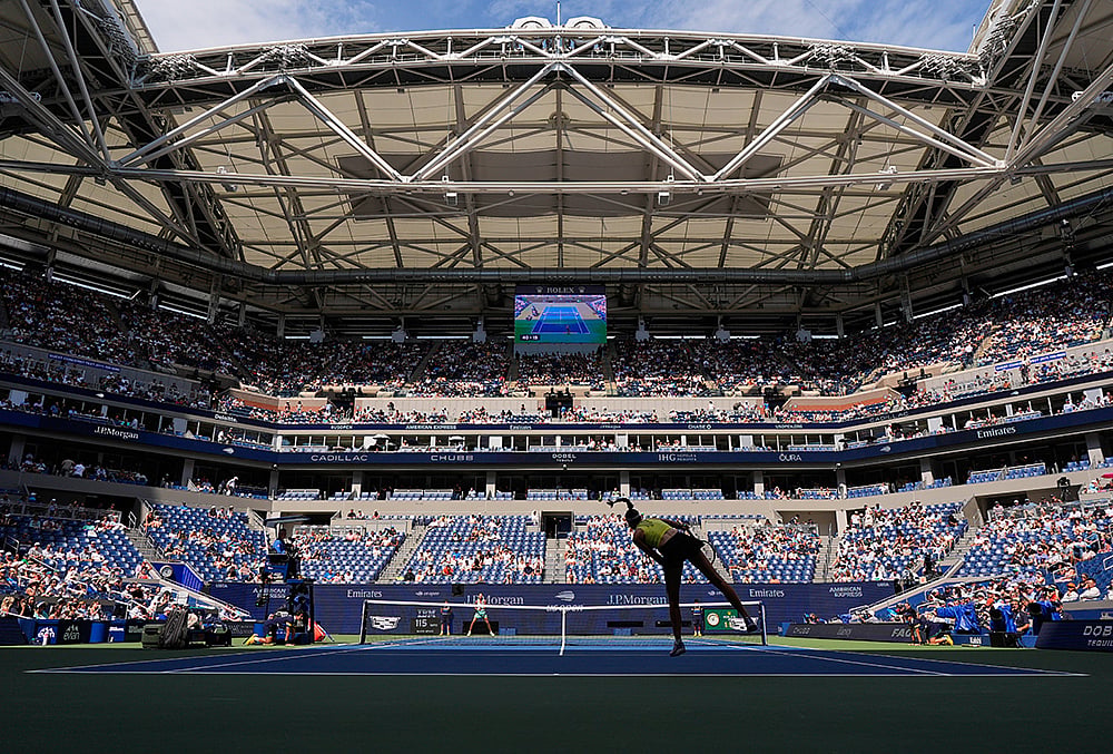 Elena Rybakina, of Kazakhstan, follows through on a serve to Qinwen Zheng, of China, during the quarterfinal round of the U.S. Open tennis championships, Wednesday, Sept. 9, 2026, in New York.