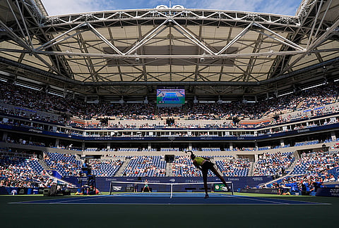 Elena Rybakina, of Kazakhstan, follows through on a serve to Qinwen Zheng, of China, during the quarterfinal round of the U.S. Open tennis championships, Wednesday, Sept. 9, 2026, in New York.