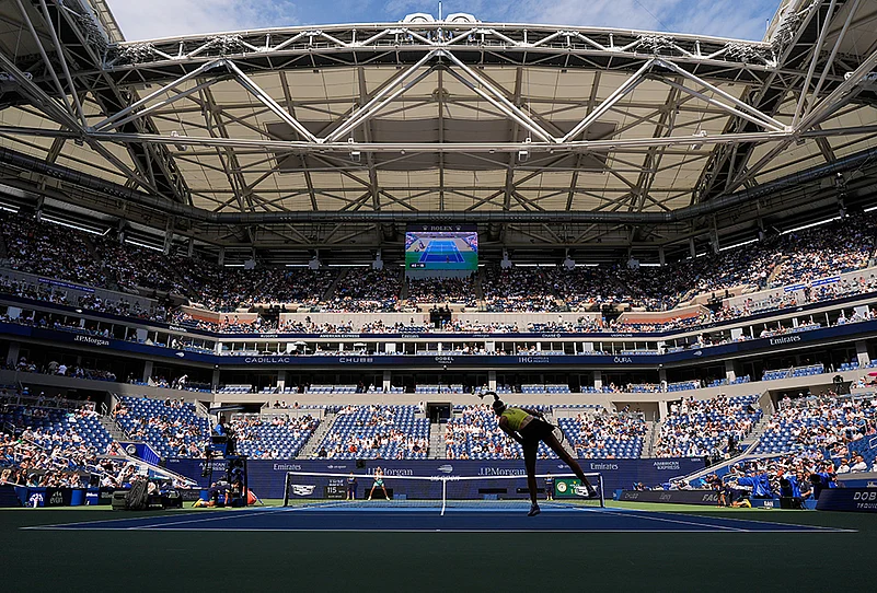 Elena Rybakina, of Kazakhstan, follows through on a serve to Qinwen Zheng, of China, during the quarterfinal round of the U.S. Open tennis championships, Wednesday, Sept. 9, 2026, in New York.