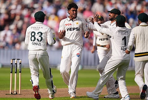 Pakistan's Razaullah Khan celebrates taking the wicket of England's Joe Root on day one of the third cricket Test between England and Pakistan in Birmingham, England, Wednesday, Sept. 9, 2026. 