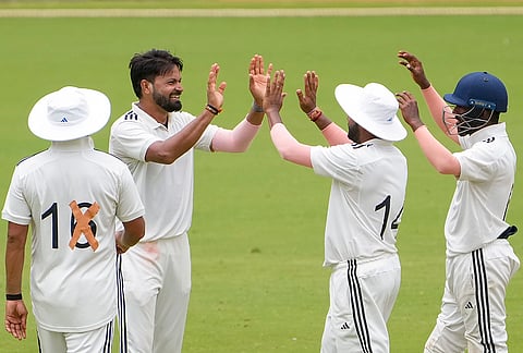 East Zone's Mukesh Kumar, second left, celebrates with teammates for the wicket of South Zone's Mohmed Siraj on day 4 of the Duleep Trophy 2026-27 final cricket match between South Zone and East Zone, in Chennai, Tamil Nadu, Wednesday, Sept. 9, 2026. 