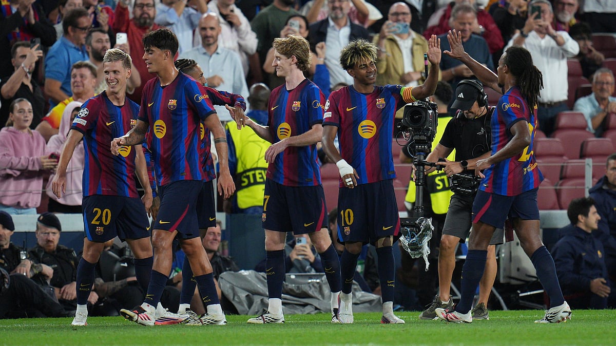 Barcelona's Lamine Yamal, second right, celebrates with teammates after scoring his side's fourth goal during the Champions League opening phase soccer between Barcelona and Feyenoord in Barcelona, Spain, Wednesday, Sept. 9, 206 - .(AP Photo/Emilio Morenatti)
