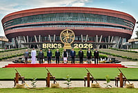 | Photo: MEA via PTI  : From left, Brazil's Foreign Minister Mauro Vieira, Abu Dhabi Crown Prince Sheikh Khaled bin Mohamed bin Zayed Al Nahyan, Indonesian President Prabowo Subianto, Egyptian President Abdel Fattah el-Sisi, Russian President Vladimir Putin, Prime Minister Narendra Modi, Chinese President Xi Jinping, South African President Cyril Ramaphosa, Iranian President Masoud Pezeshkian and Ethiopian Prime Minister Abiy Ahmed Ali pose for a group photograph amid the ongoing 18th BRICS Summit, at the Bharat Mandapam, in New Delhi. 
