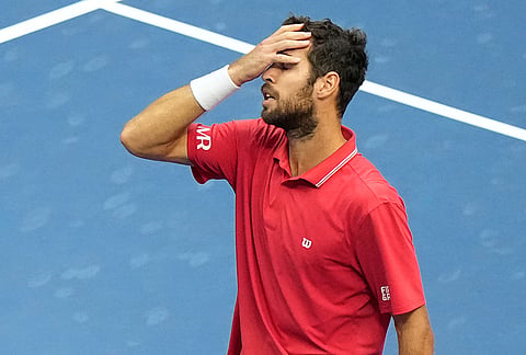 Karen Khachanov, of Russia, reacts after he lost his match to Alexander Zverev, of Germany, during the men's singles semifinals of the U.S. Open tennis championships Friday, Sept. 11, 2026, in New York. 