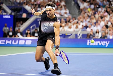 Ben Shelton, of the United States, returns the ball to Frances Tiafoe, of the United States, during the men's singles semifinals of the U.S. Open tennis championships Friday, Sept. 11, 2026, in New York. 