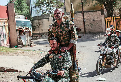 Yemen's Houthi rebels ride a motorbike during a mobilization campaign in Sanaa, Yemen, Thursday, Sept. 10, 2026. 
