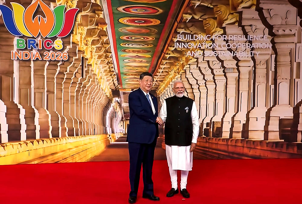 PM Modi Xi Jinping handshake photo BRICS Delhi