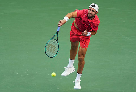 Karen Khachanov, of Russia, serves to Alexander Zverev, of Germany, during the men's singles semifinals of the U.S. Open tennis championships, Friday, Sept. 11, 2026, in New York. 
