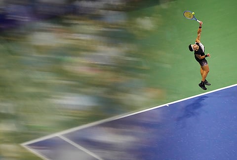 Ben Shelton, of the United States, serves the ball to Frances Tiafoe, of the United States, during the men's singles semifinals of the U.S. Open tennis championships Friday, Sept. 11, 2026, in New York. 