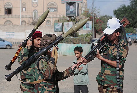 Yemen's Houthi rebels chat as they check their weapons during a mobilization campaign in Sanaa, Yemen, Thursday, Sept. 10, 2026. 