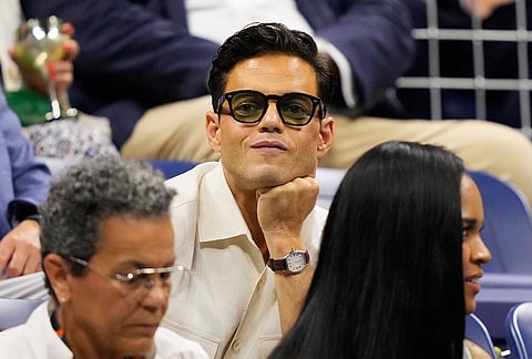 Rami Malek attends a match between Frances Tiafoe, of the United States, and Ben Shelton, of the United States, during the men's singles semifinals of the U.S. Open tennis championships Friday, Sept. 11, 2026, in New York. 