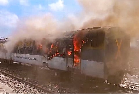 Flame and smoke billow after fire broke out at a railway track maintenance machine parked at Shikohabad railway station, in Firozabad, Punjab.