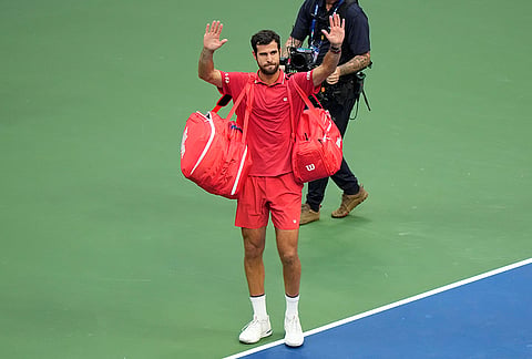 Karen Khachanov, of Russia, gestures after he lost his match to Alexander Zverev, of Germany, during the men's singles semifinals of the U.S. Open tennis championships Friday, Sept. 11, 2026, in New York. 
