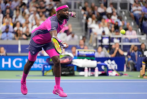 Frances Tiafoe, of the United States, returns the ball to Ben Shelton, of the United States, during the men's singles semifinals of the U.S. Open tennis championships Friday, Sept. 11, 2026, in New York. 