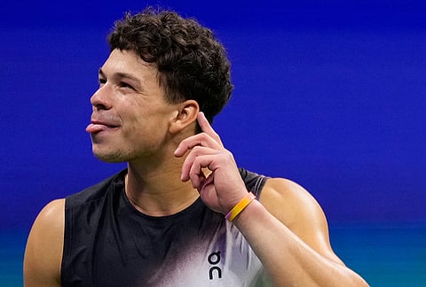 Ben Shelton, of the United States, gestures to the crowd after he won his match against Frances Tiafoe, of the United States, during the men's singles semifinals of the U.S. Open tennis championships Friday, Sept. 11, 2026, in New York. 