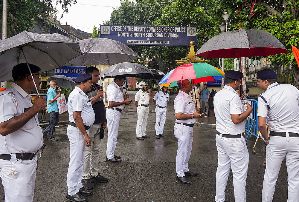 Police official during Congress protest in Kolkata