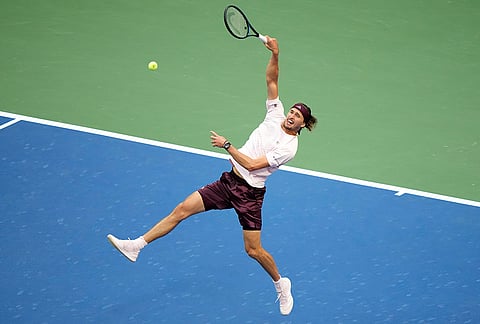 Alexander Zverev, of Germany, returns the ball to Karen Khachanov, of Russia, during the men's singles semifinals of the U.S. Open tennis championships Friday, Sept. 11, 2026, in New York. 