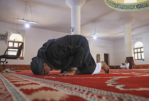 A worshipper prostrates in prayer at the Al-Shamy Mosque in Houthi-controlled Sanaa, Yemen, Friday, Sept. 11, 2026. 
