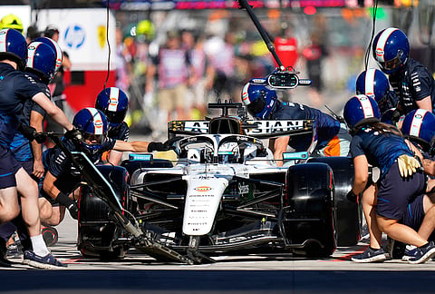 Williams driver Alexander Albon of Thailand gets a pit service during the second free practice ahead of the Spanish Formula One Grand Prix, in Madrid, Friday, Sept. 11, 2026.