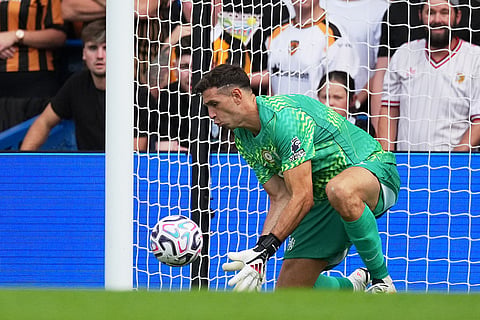 Chelsea's goalkeeper Emiliano Martinez makes a save during the English Premier League soccer match between Chelsea and Hull City in London.