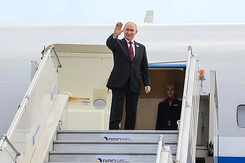In this image released on Sept. 13, 2026, Russian President Vladimir Putin waves as he emplanes after attending the 18th BRICS Summit, in New Delhi.