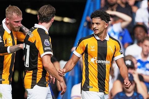 Hull City's Mohamed Belloumi celebrates after scoring his side's second goal during the English Premier League soccer match between Chelsea and Hull City in London.