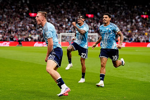 Nottingham Forest's Liam Delap celebrates scoring the opening goal during the English Premier League soccer match between Aston Villa and Nottingham Forest in Birmingham, England.