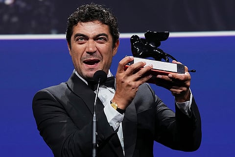 Riccardo Scamarcio accepts the Orizzonti best actor award for 'Children of the Monkey' during the closing ceremony of the 83rd edition of the Venice Film Festival in Venice, Italy.